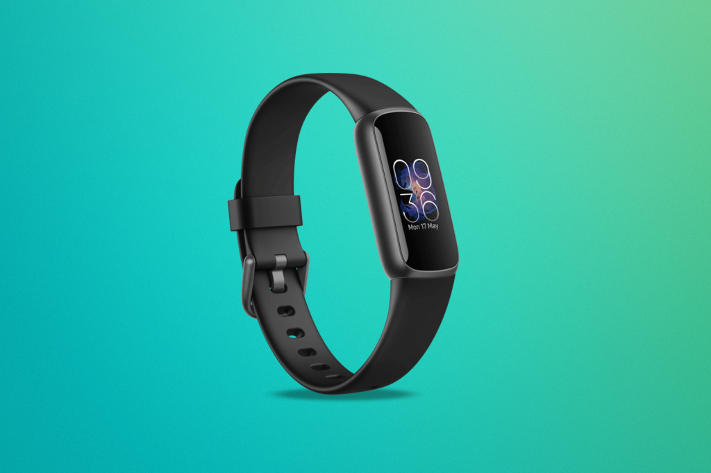 Fitbit Inspire 3 against a green/blue background