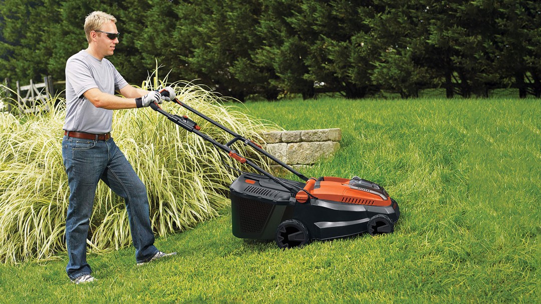 cordless lawnmower cutting grass