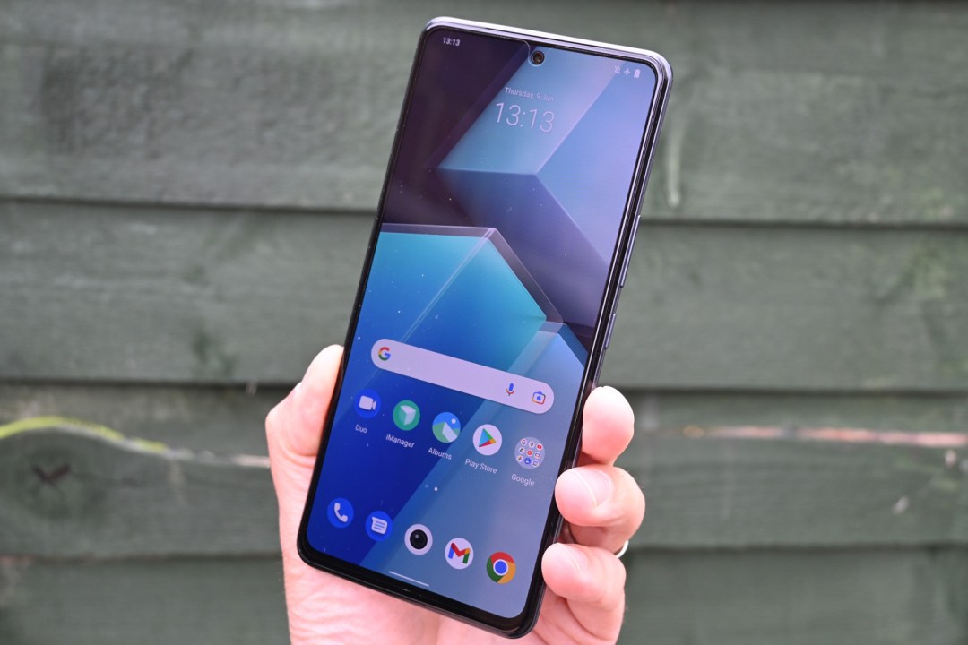 Stuff IQOO Neo 6 smartphone review front of the phone against a green fence