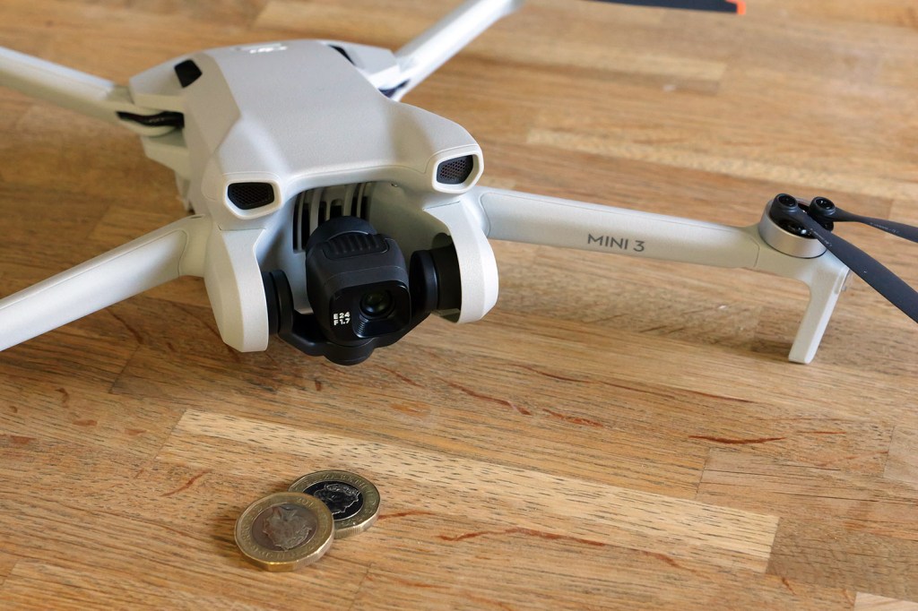 dji mini 3 with coins