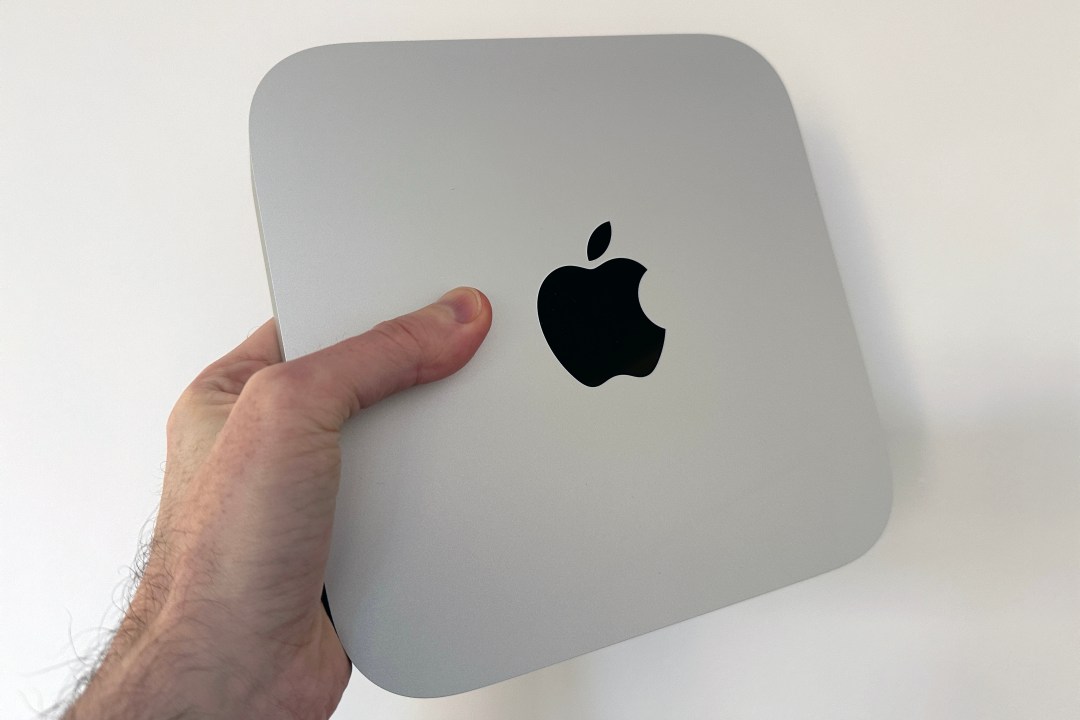 Mac mini being held