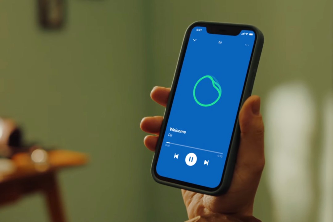 Spotify's new AI-powered DJ feature open in-app on iPhone in a hand