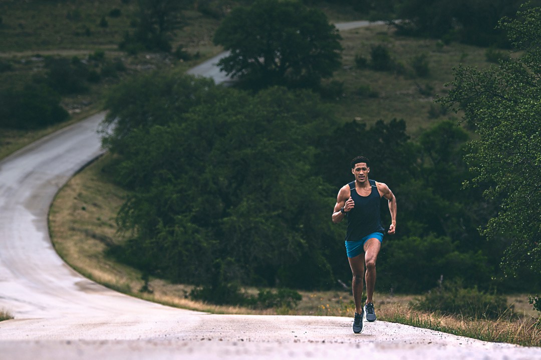 A runner, possibly wearing a Garmin watch